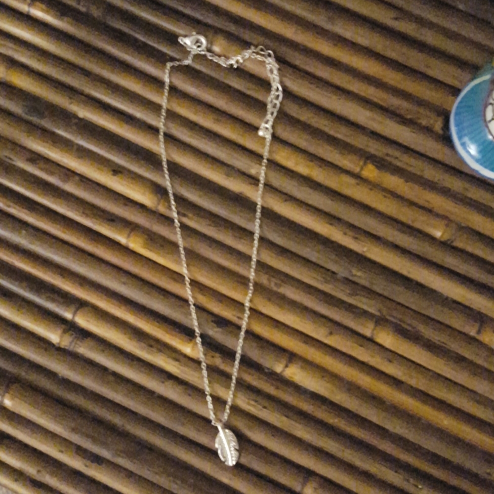 NWOT silver necklace with leaf charm